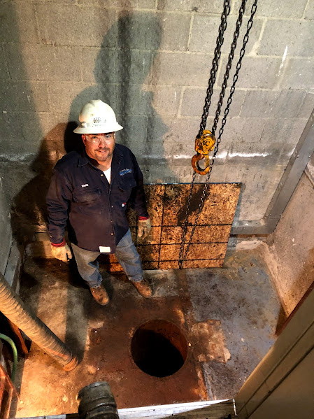 Clean out hole for hydraulic ram of elevator