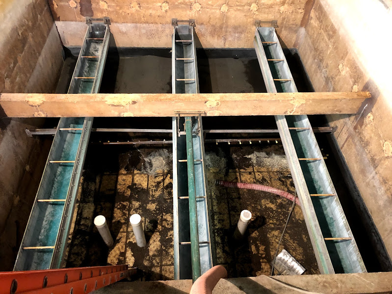 Removing filter material at fresh water treatment facility